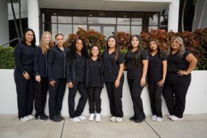 Dental Assisting graduates standing in a line.